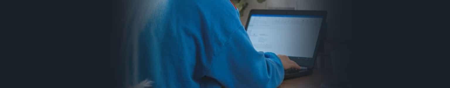 Employee working at her laptop who is trying to increase her work efficiency