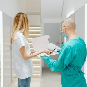 A person stands in an immaculately clean indoor space.