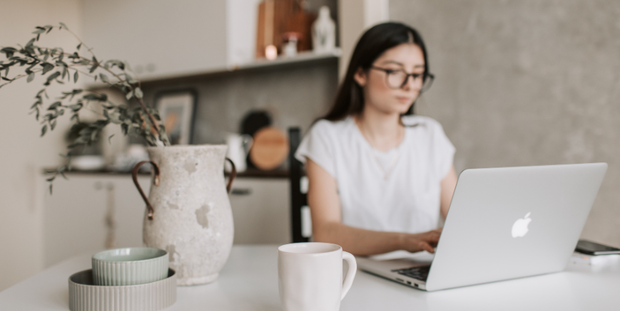 Remote Work - Woman working remotely from home on laptop, representing flexible work policies in Australia