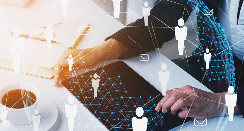 Person interacting with digital HR technology interface, illustrating the balance between automation and the human touch in HR in 2026.