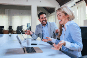 Why hire an hr contractor, Two professionals smiling during a business meeting