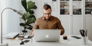 Employee working from home on laptop illustrating Victoria work from home laws employers must comply with