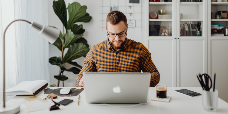 Employee working from home on laptop illustrating Victoria work from home laws employers must comply with