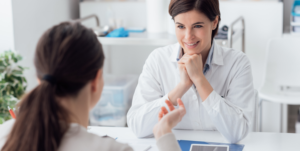 Employee discussing medical leave and return-to-work plan with healthcare professional