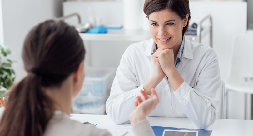 Employee discussing medical leave and return-to-work plan with healthcare professional