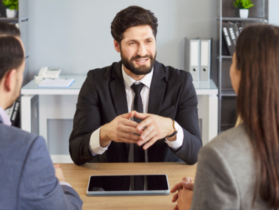 Manager discussing employee performance improvement plan in a workplace meeting