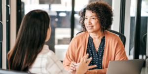 Manager discussing flexible work arrangements and hybrid work policy with employee in Victoria